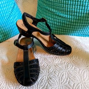 Strappy black low heels.